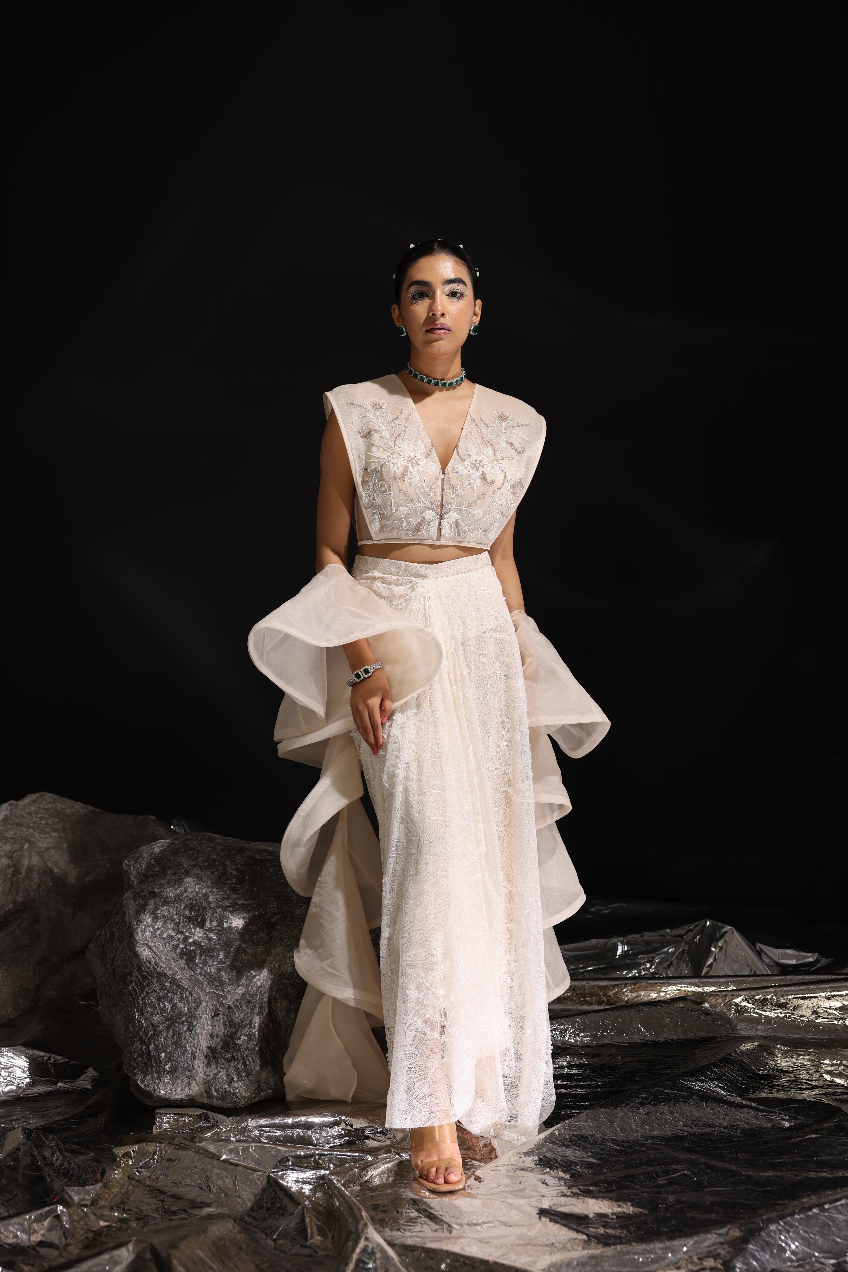 Ivory embroidered top with asymmetrical draped skirt