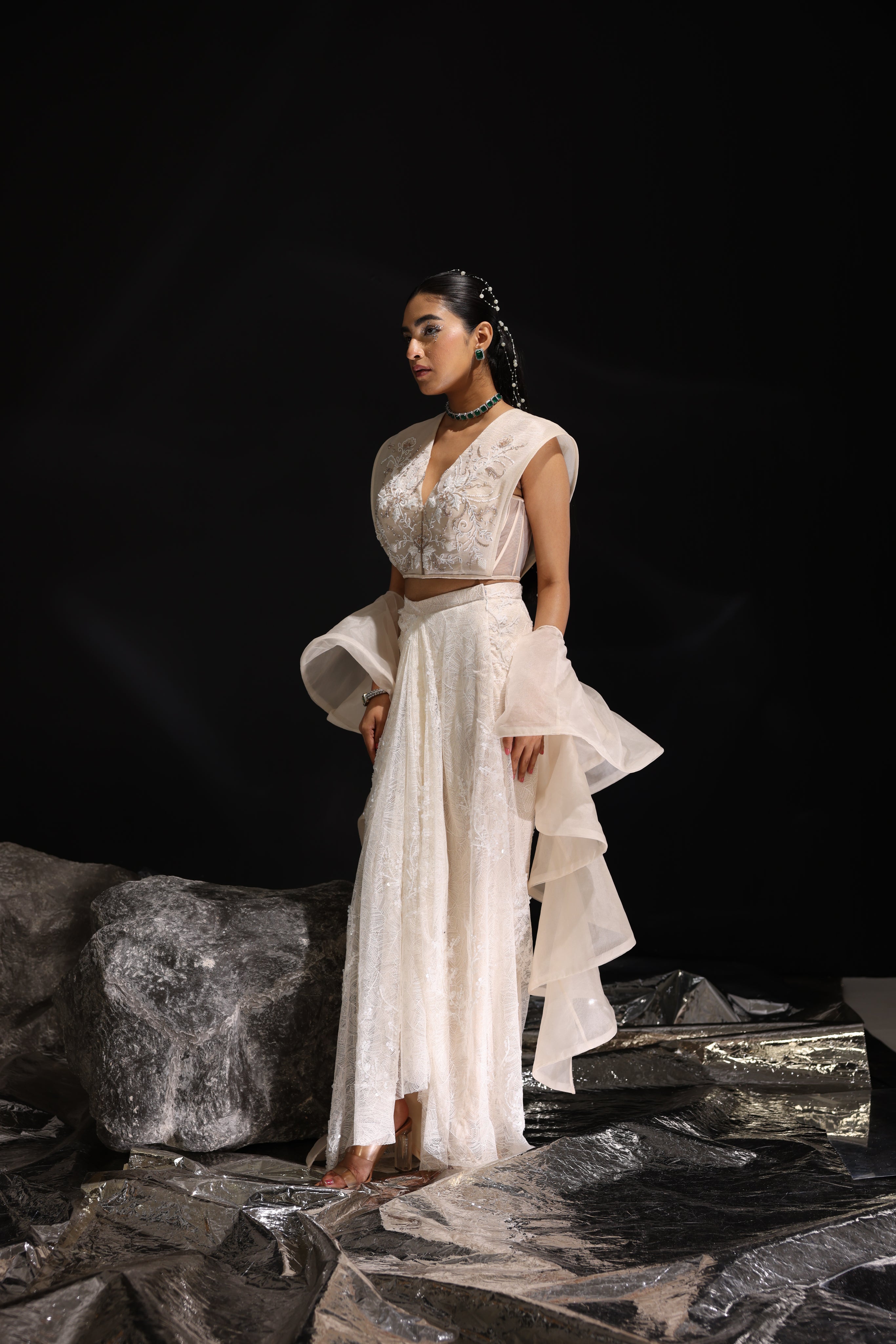 Ivory embroidered top with asymmetrical draped skirt