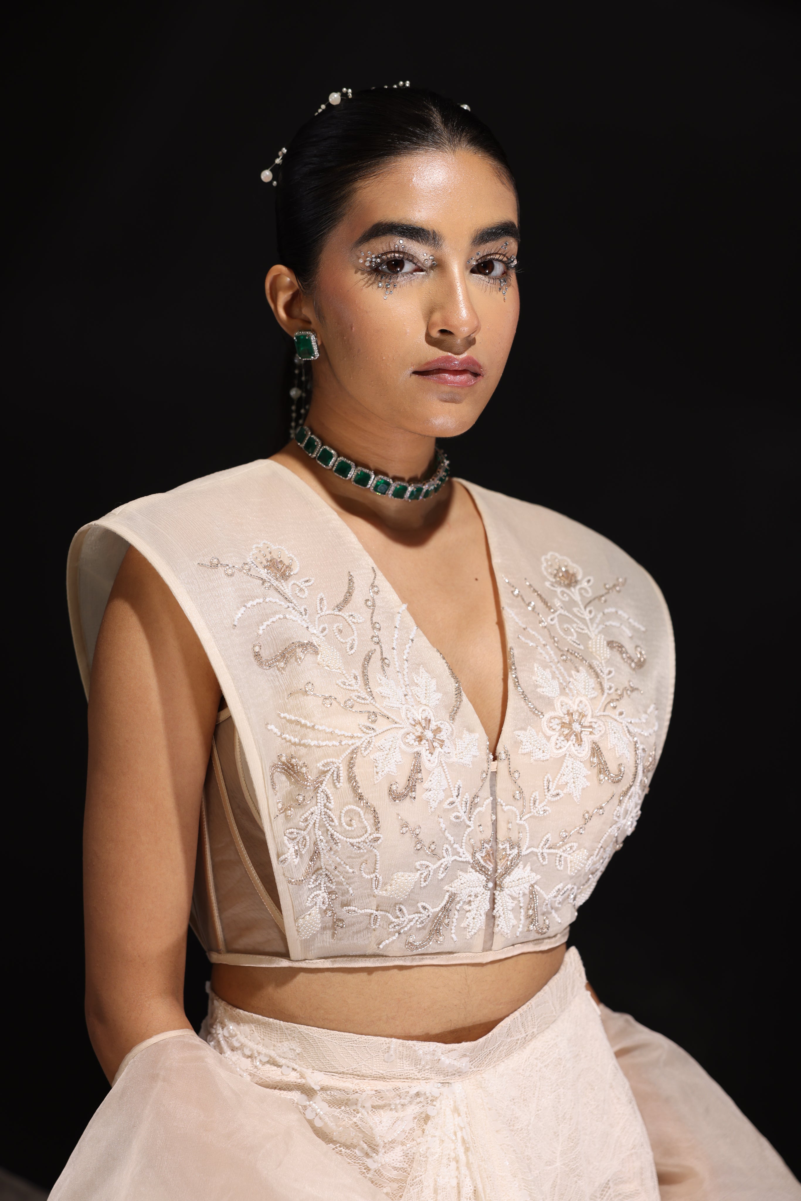 Ivory embroidered top with asymmetrical draped skirt