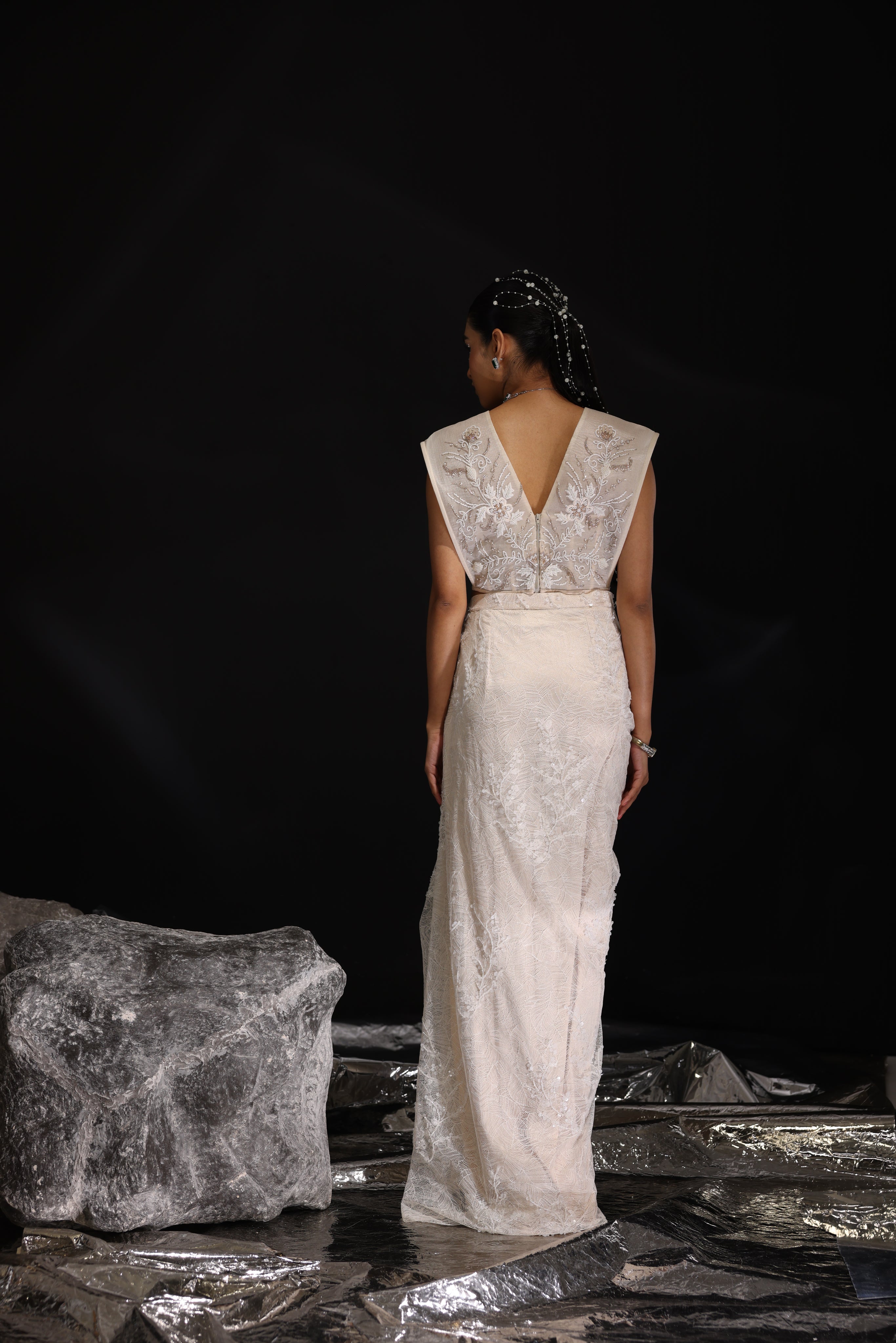 Ivory embroidered top with asymmetrical draped skirt