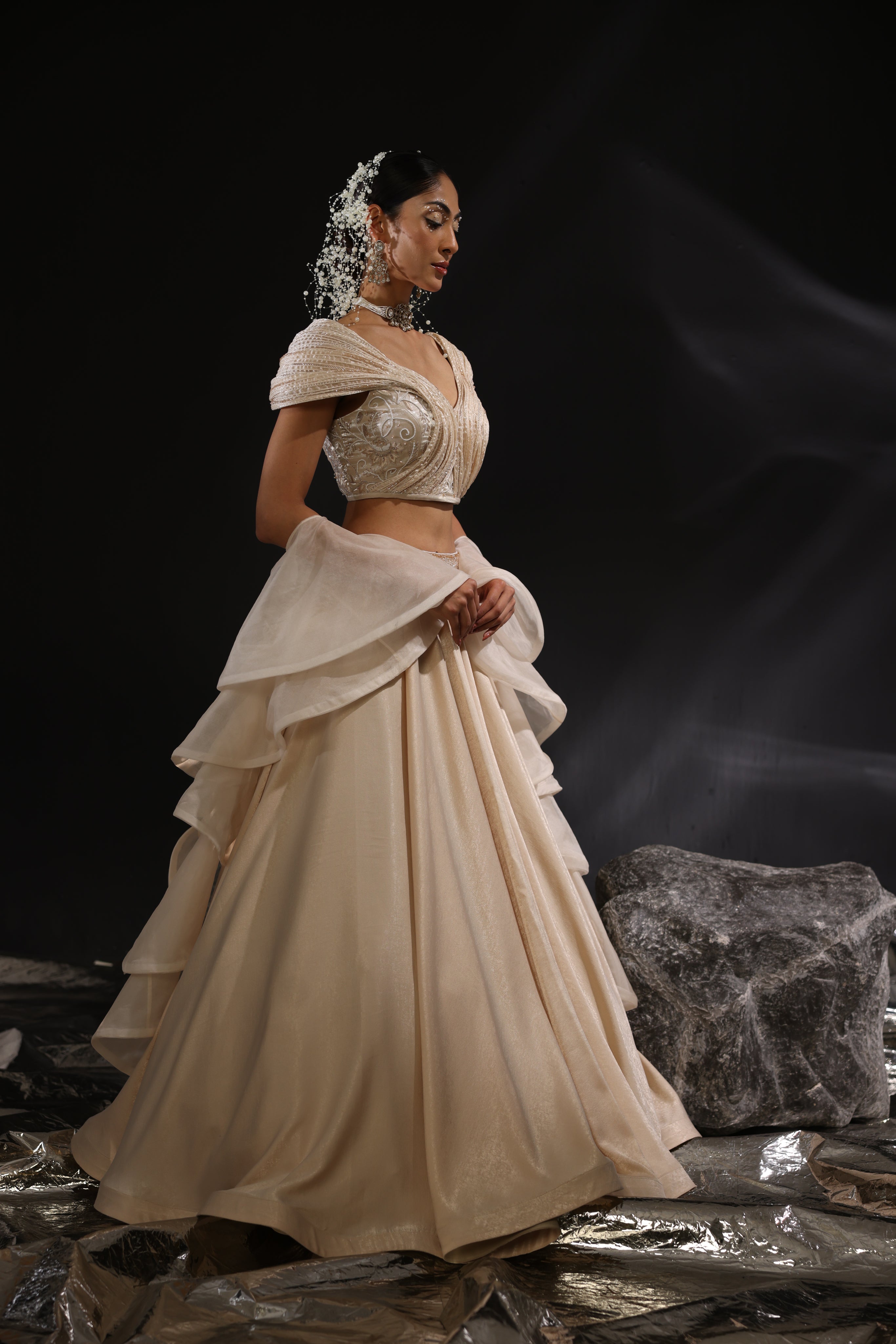 Sculpted blouse paired with ruffle dupatta & lehenga