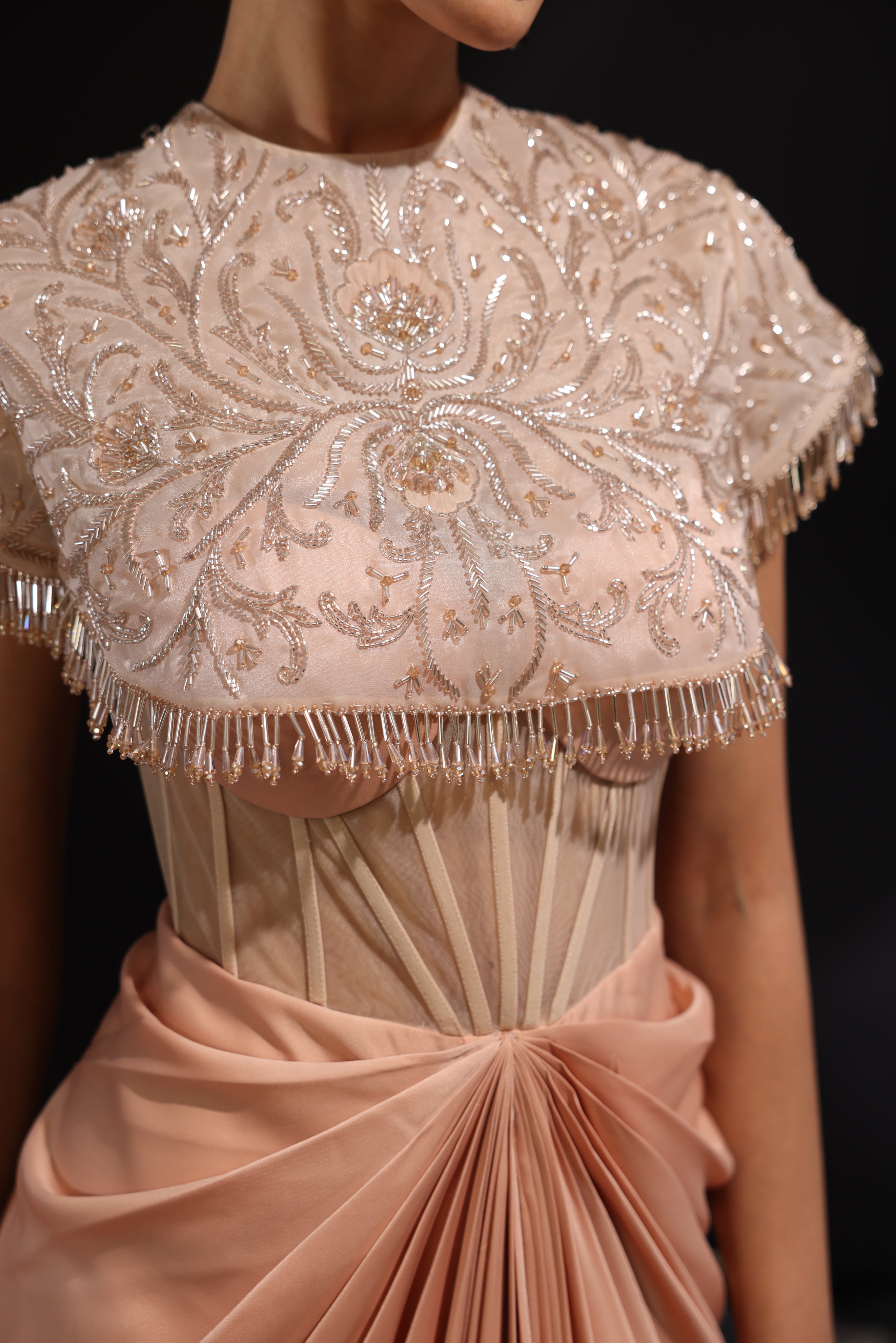 Peach embroidered corseted draped saree