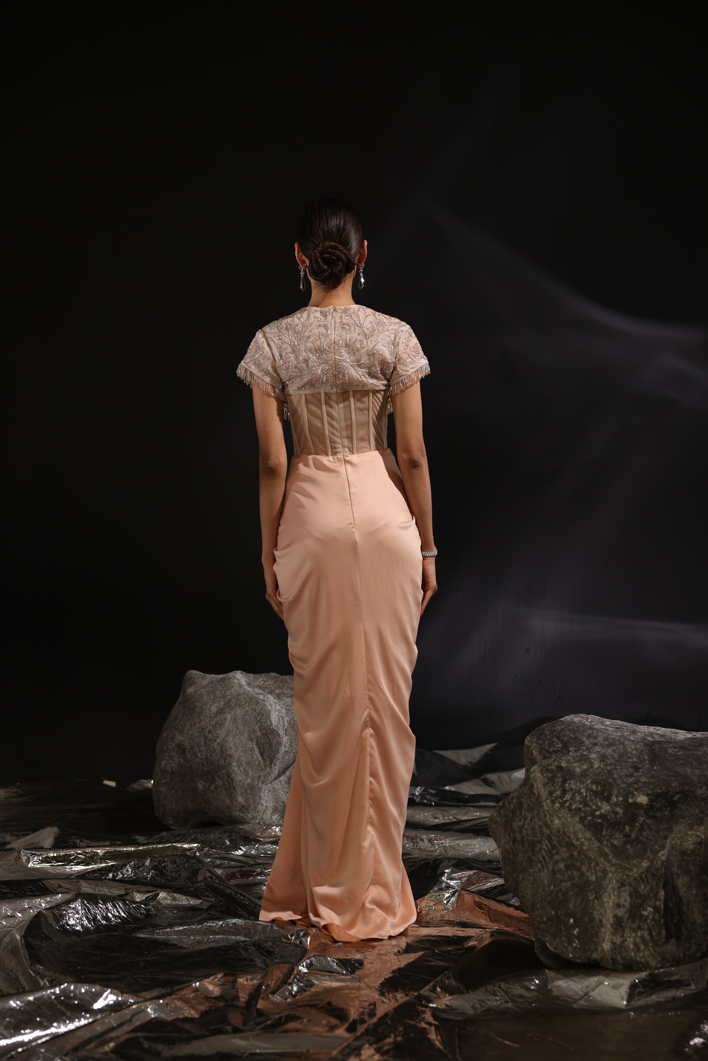 Peach embroidered corseted draped saree