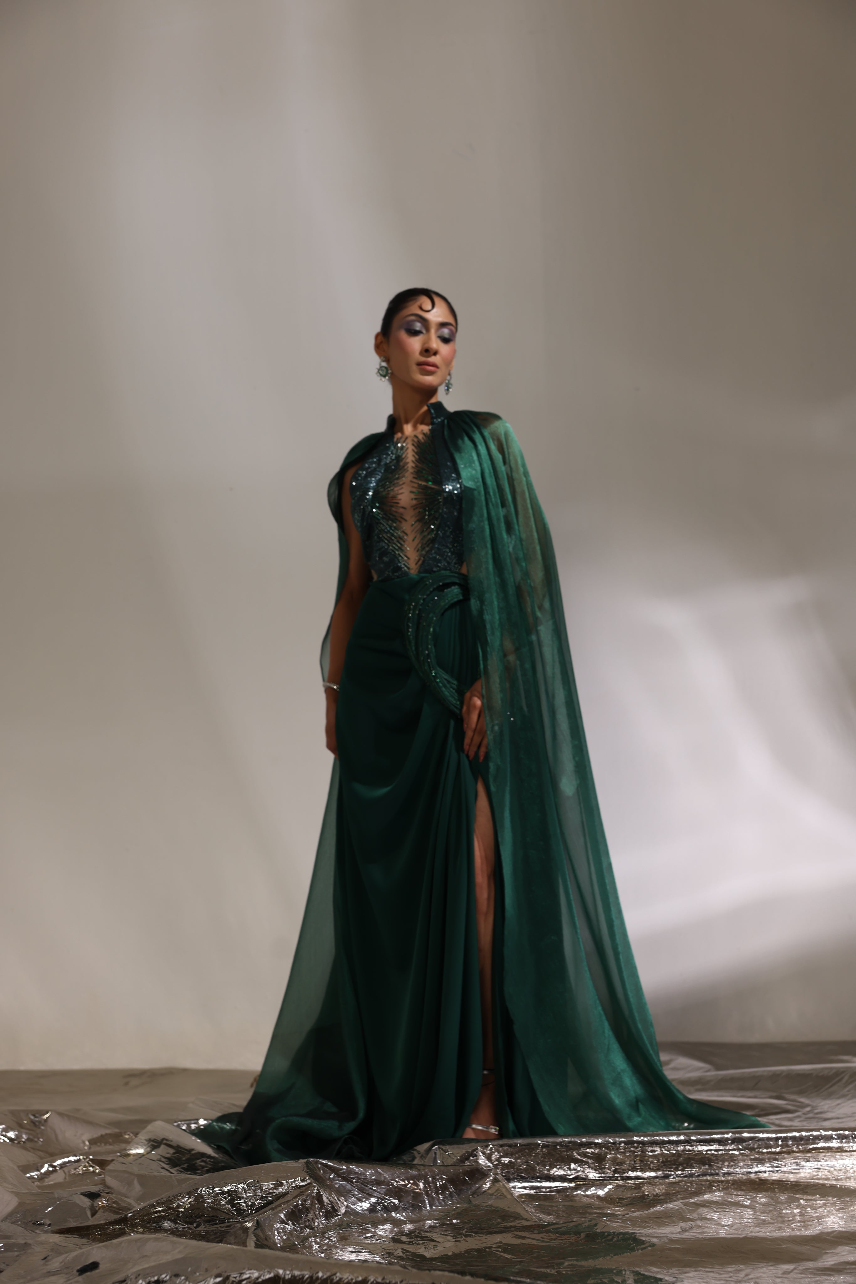 Forest green collared draped saree with cape