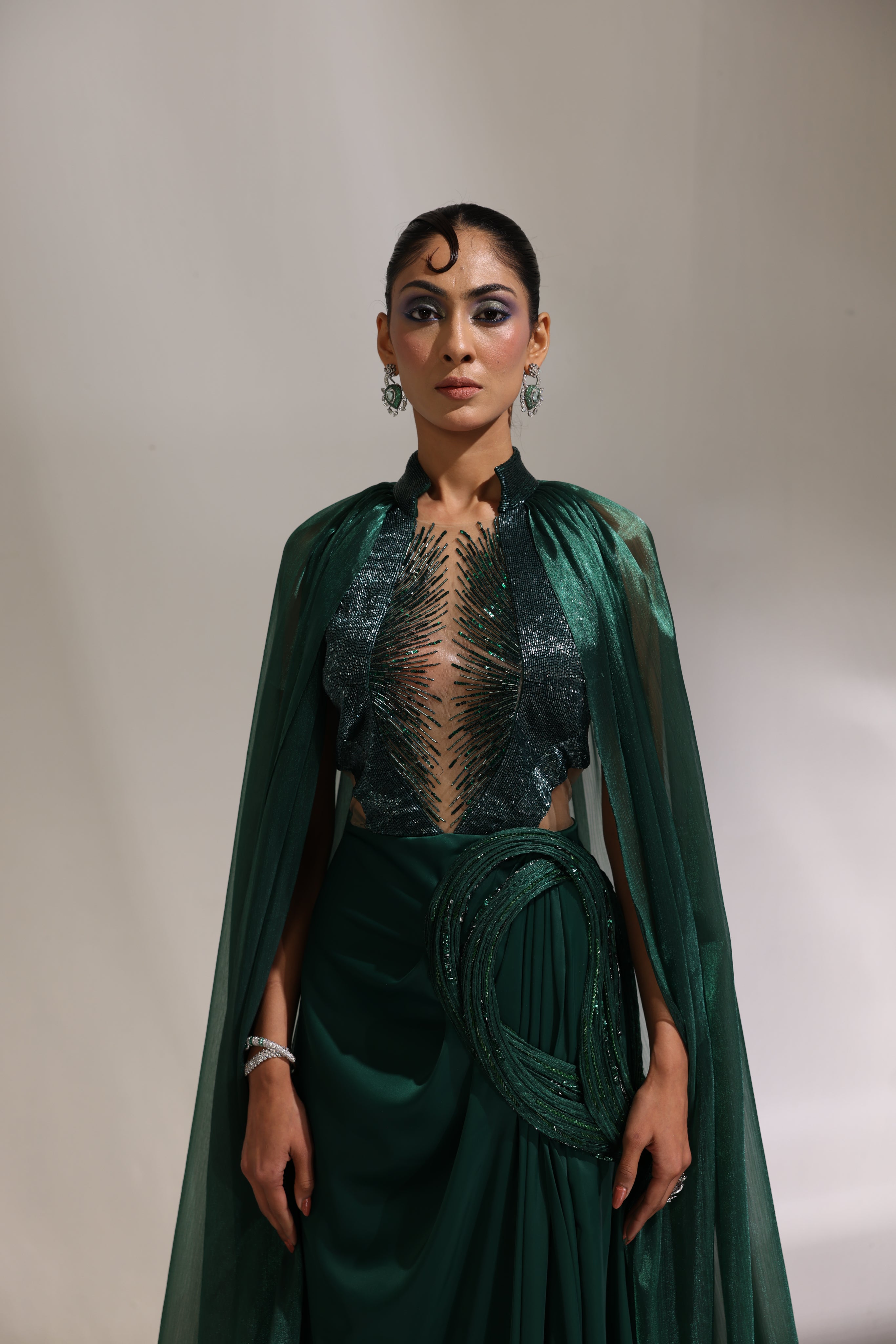 Forest green collared draped saree with cape