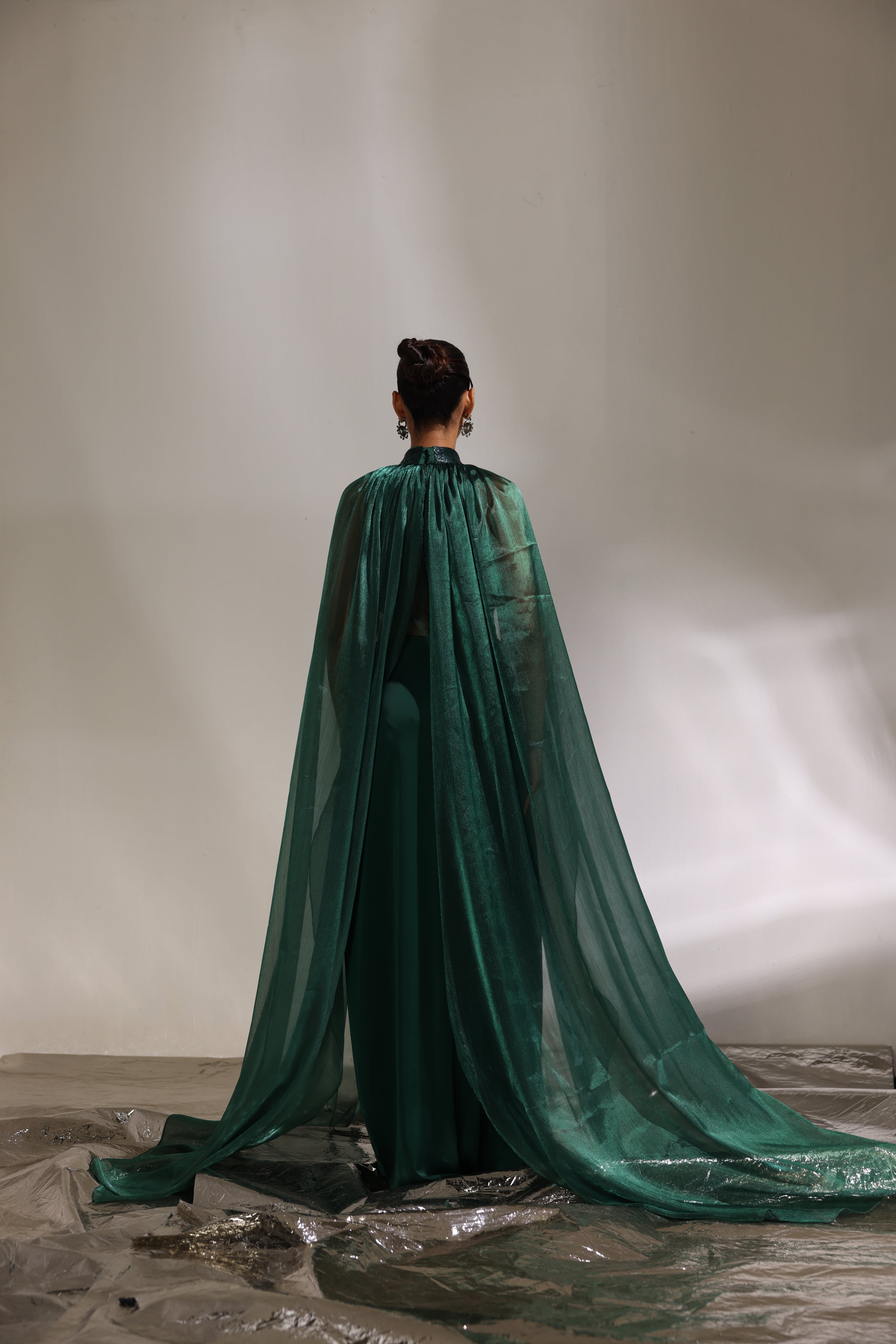 Forest green collared draped saree with cape